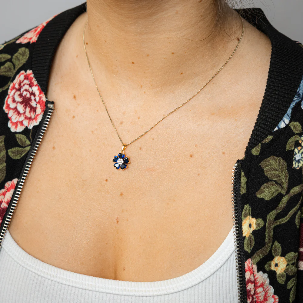 Sterling Silver Gold Plated White And Sapphire Blue Cubic Zirconia Flower Pendant
